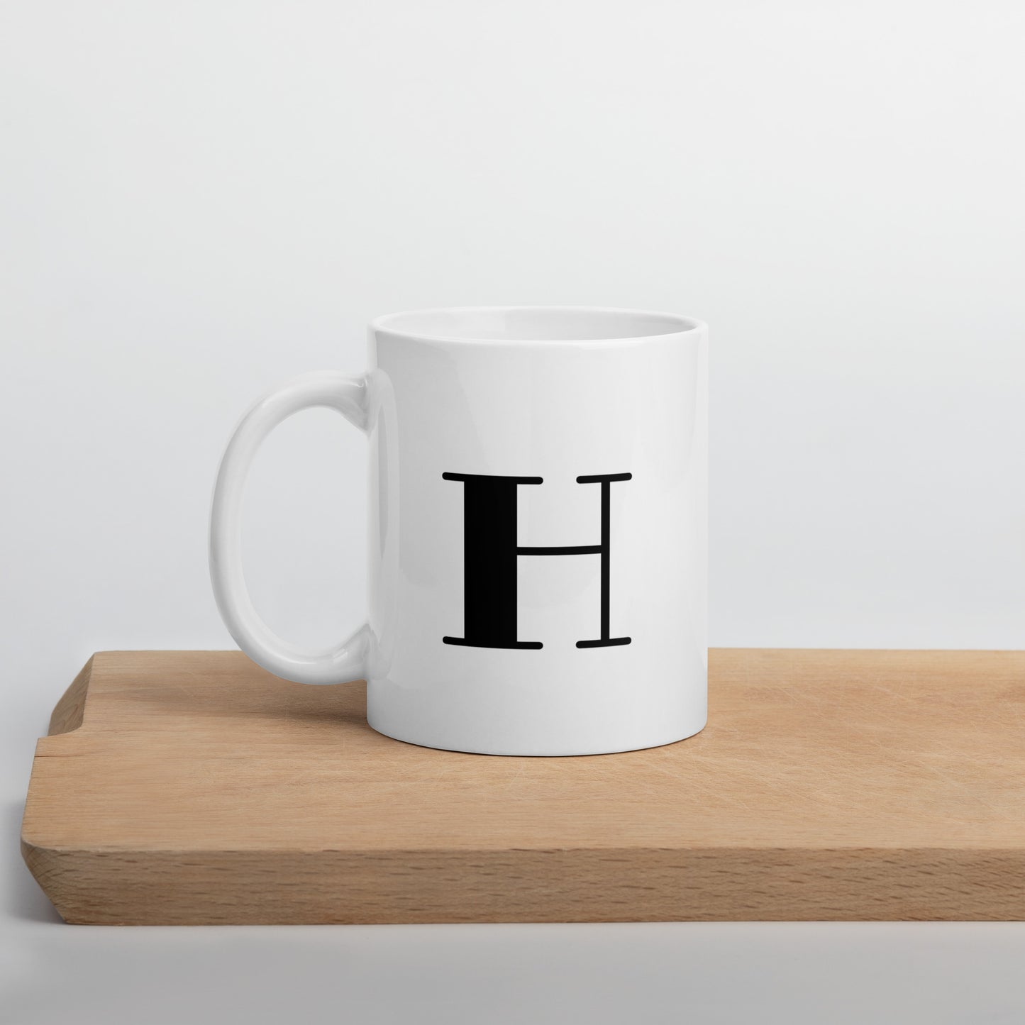 White glossy initial mug H