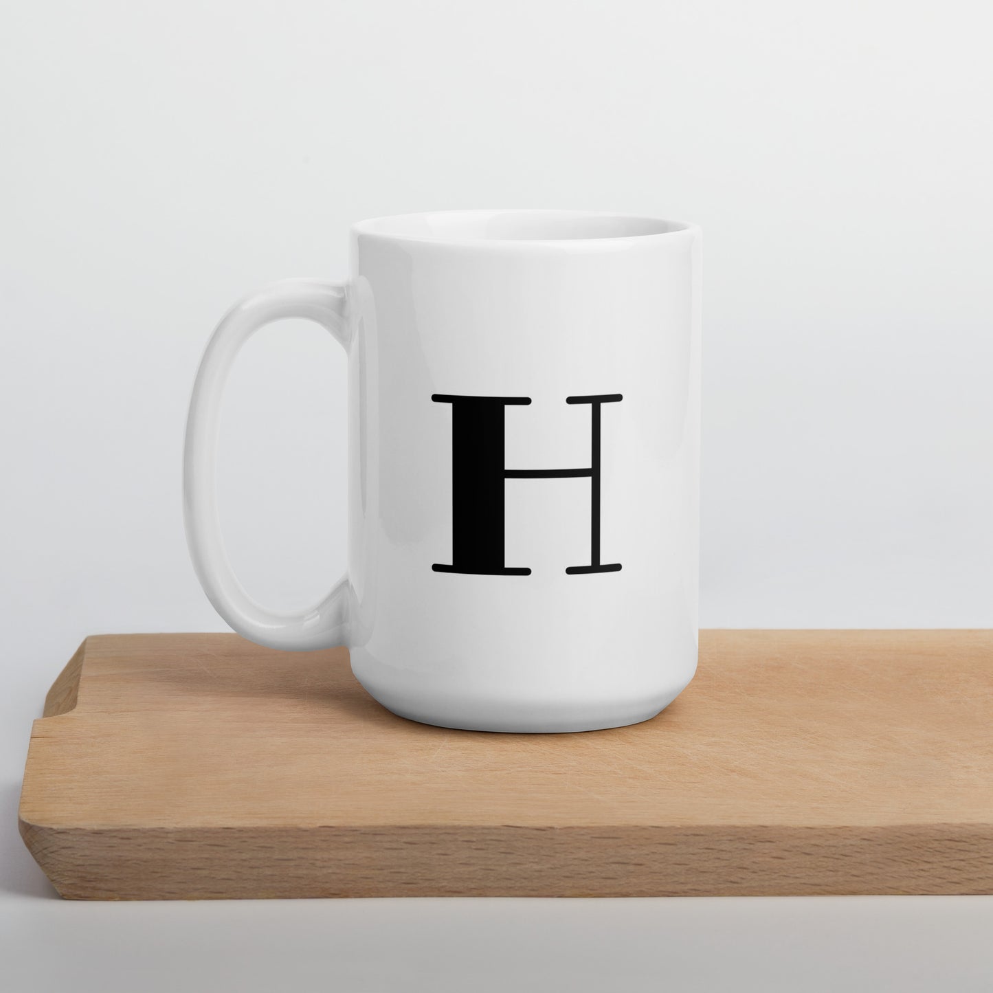 White glossy initial mug H